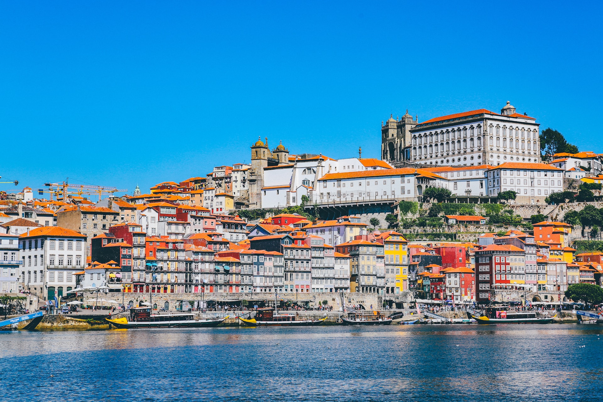 Coastline of Porto, Portugal with boats and terracotta buildings