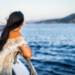 Woman Peacefully Observing the Vastness of the Sea from Aboard a Boat