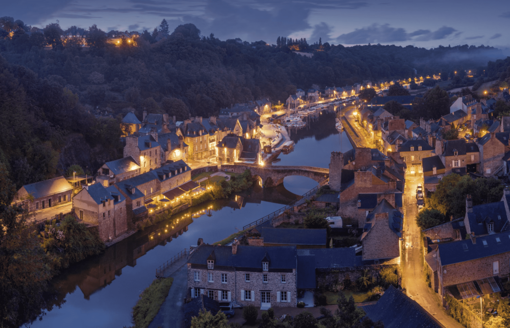 Aerial Night View of Lit Buildings with River in the Middle