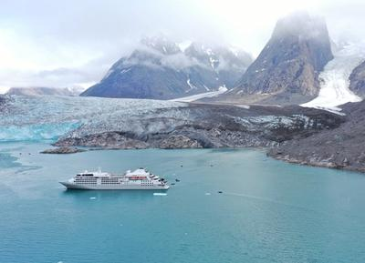 Silversea cruise ship near the mountains.